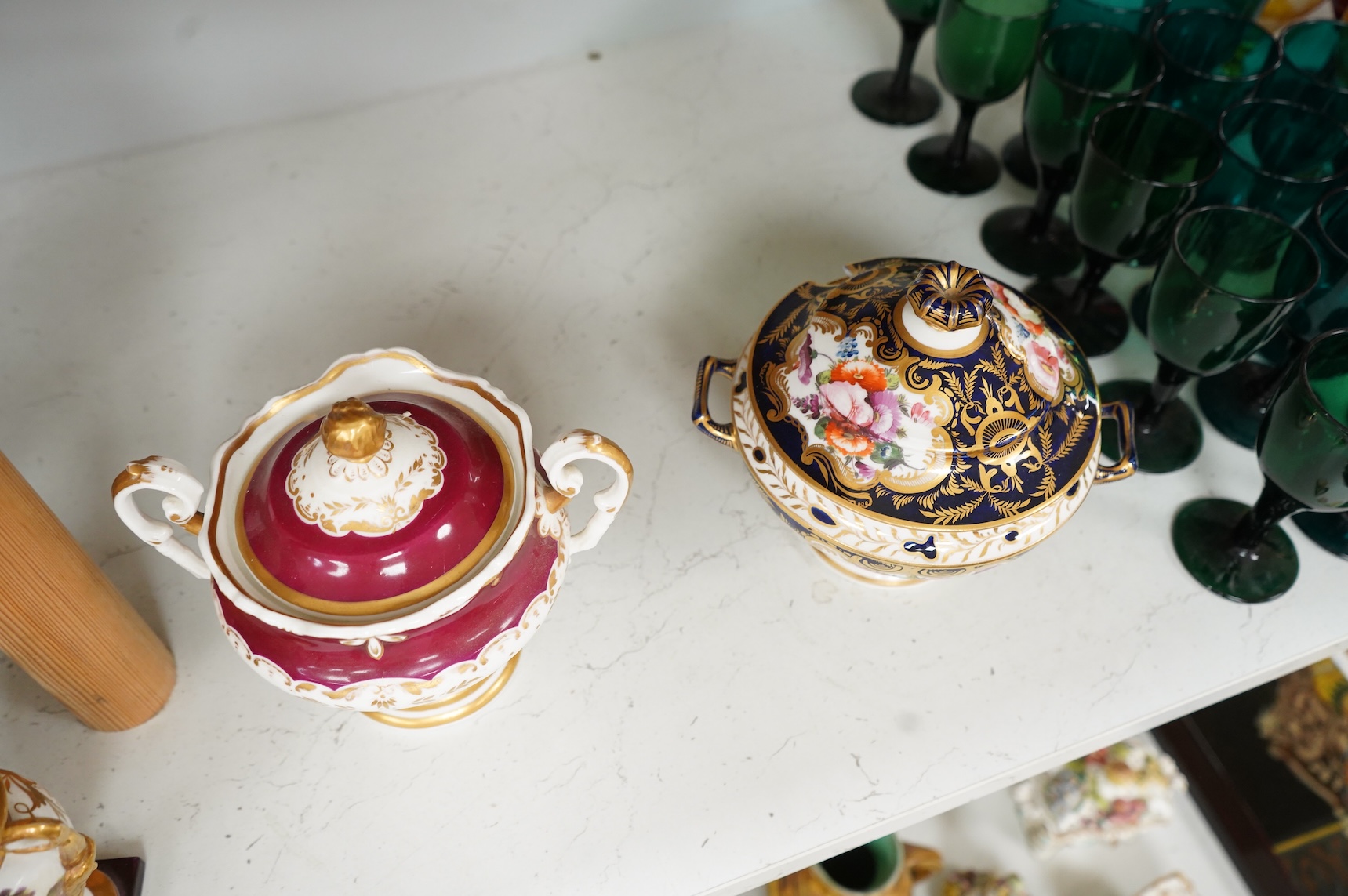 A Group of early 19th century English porcelain; to sauce tureens and covers, one with stand, a covered sugar bowl, a two handled vase, a pot pourri vase and cover, a milk jug and a hydra shaped jug, largest 16cm high